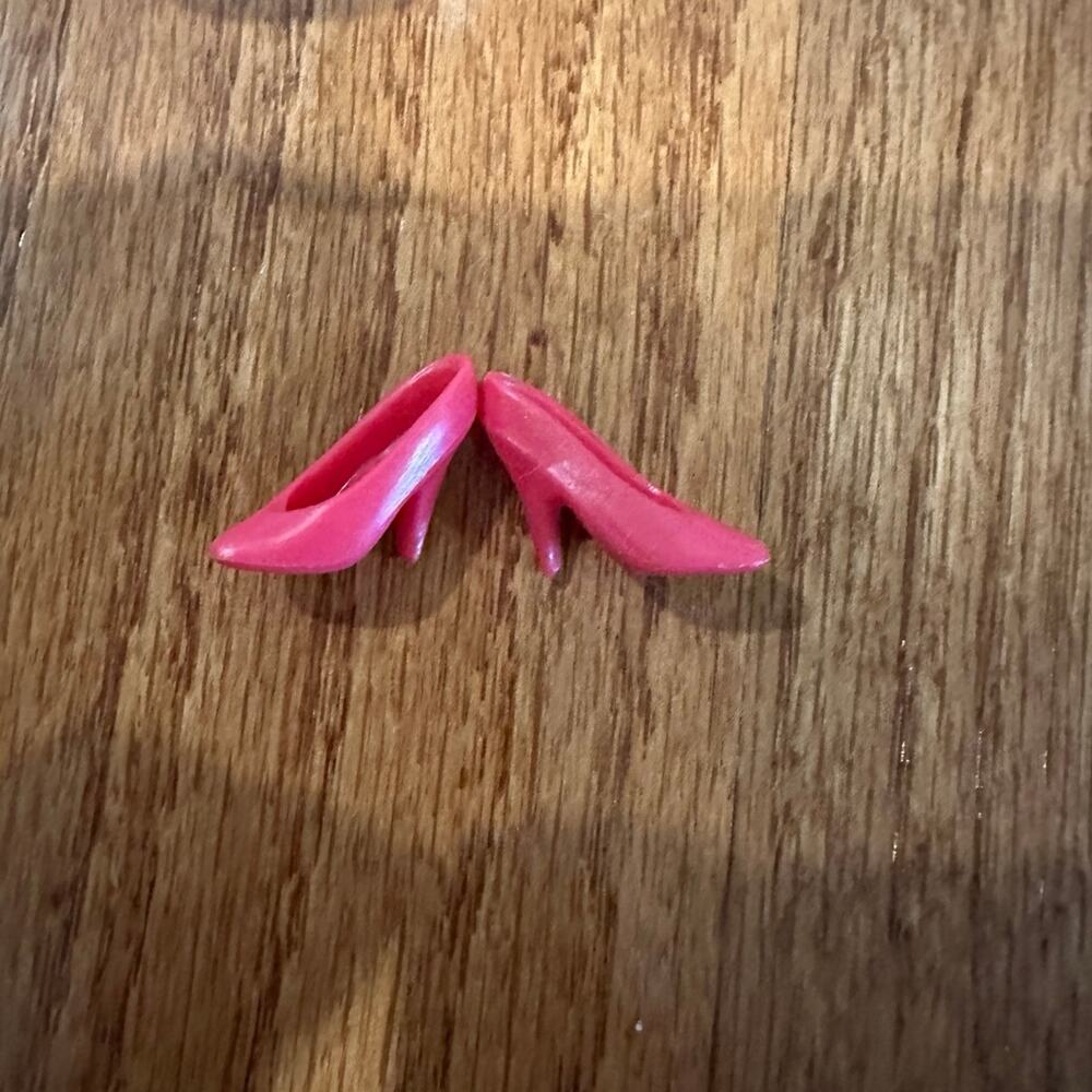 Vintage pink high heal sneakers sized for Barbie